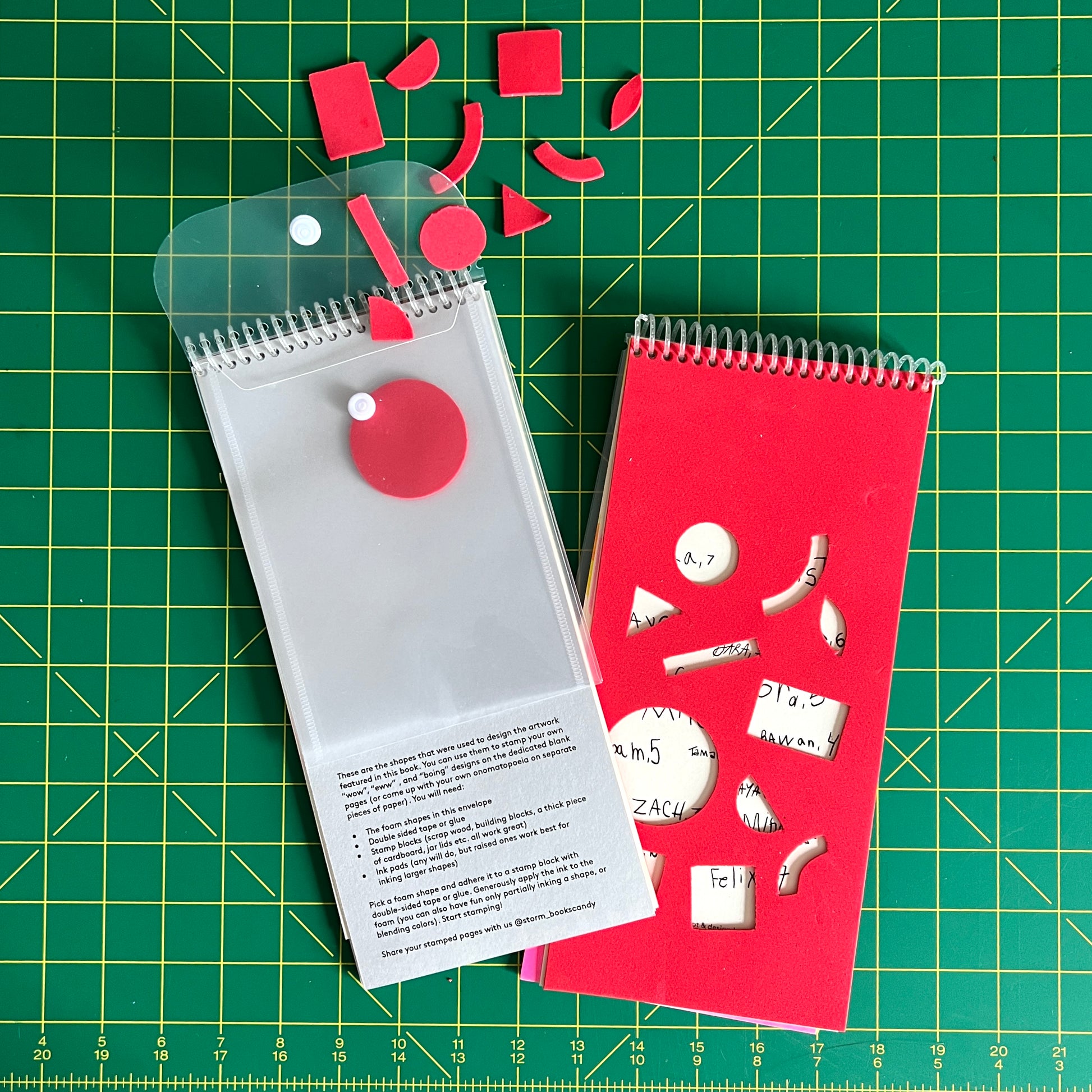 Two copies of the book are stacked to front and back of the book. On the backside a clear plastic resealable envelope has been coil bound into the book. Spilling out of it are foam shapes, taken from the dicut holes on the over. On Gray cardstock, instructions are printed on how to use them to make your own stamps. 