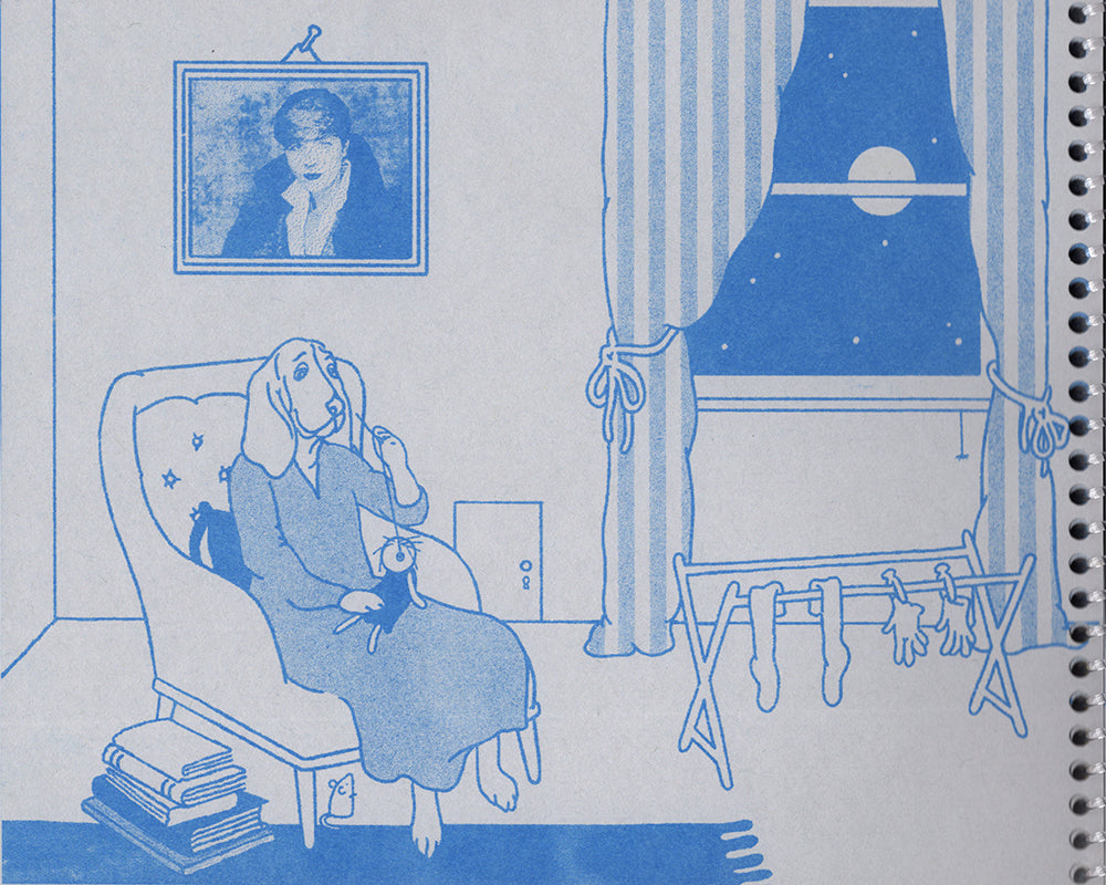 A page from the zine, risograph printed on gray paper with a clear coil binding. A more adult-like basset hound in a long dress is sewing an eye onto a doll. The dog sits in a plush armchair, with a stack of books at her feet, and a rack of drying socks and gloves nearby. On the wall behind is a framed picture of author Djuana Barnes, a tiny door with a key hold, and a window with large striped drapes that looks out onto a starry night sky with a full moon. 